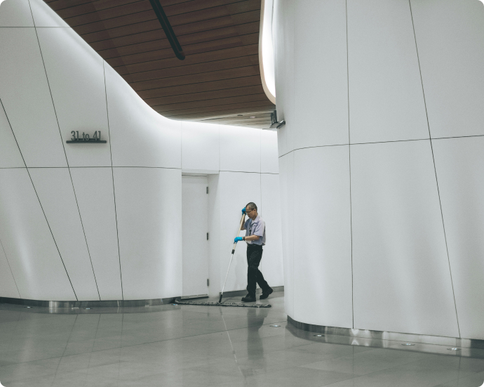 senior_man_cleaning_inside_building